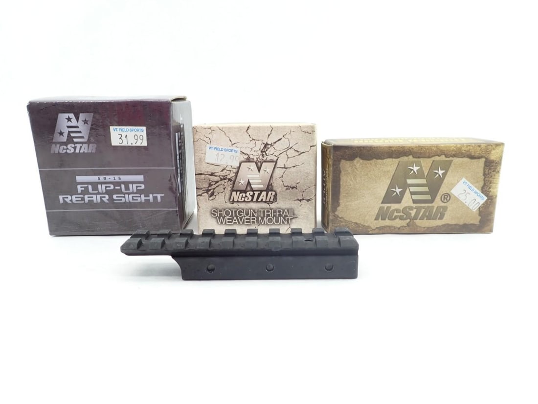 Assorted Picatinny Accessories: Including NcStar flip up rear sight, NcStar trigger guard laser, NcStar shotgun tri rail weaver mount, and Retay picatinny adapter