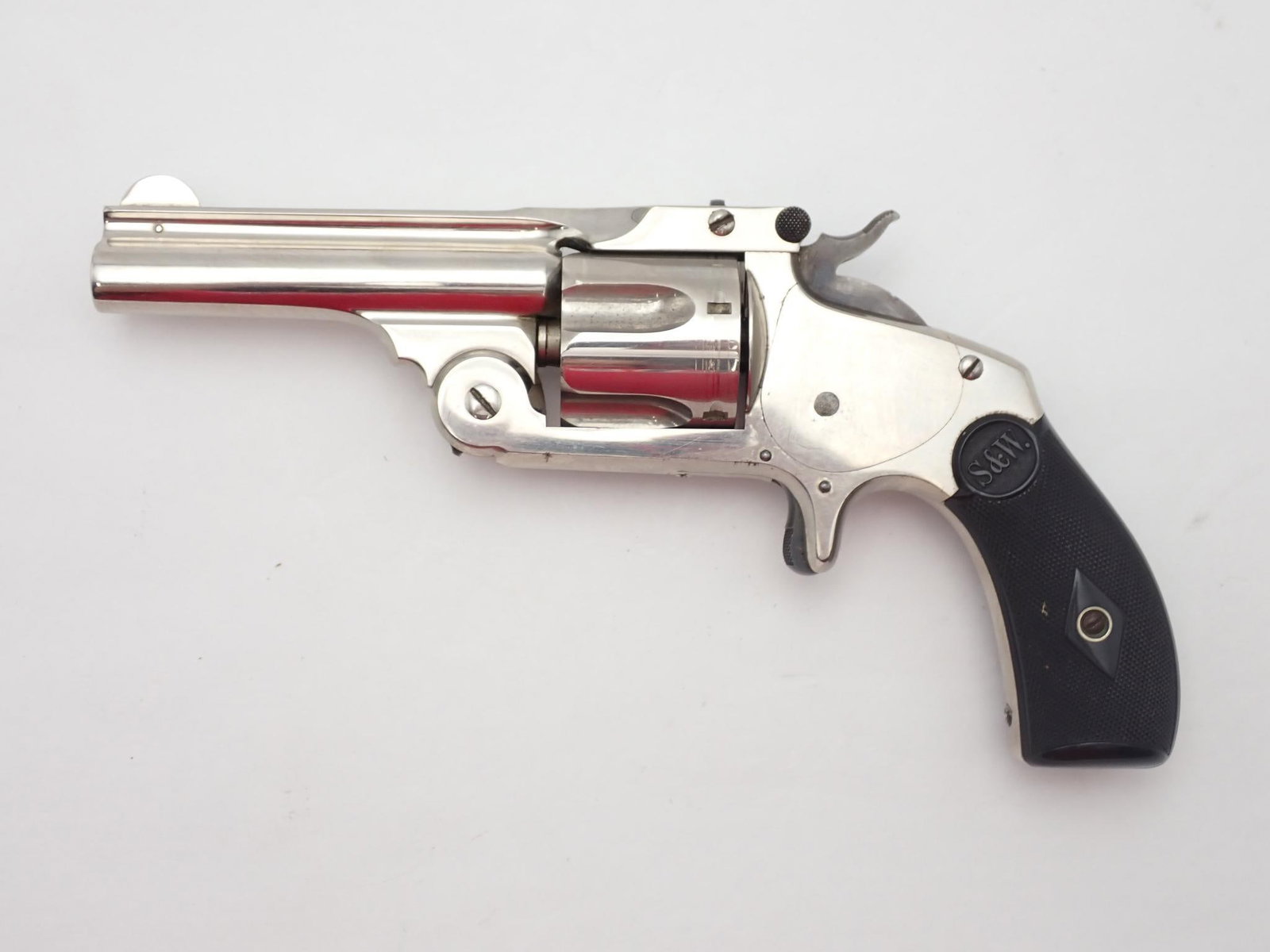 Smith & Wesson Model 2 Number 2 Revolver: SN: 24416 Year of Mfg: 1878 Cal: .38 S&W Action Type: Single Action Barrel Length: 3.25" Sights/Optics: Original fixed open sights Stock: Black hard rubber grips Finish: Nickel Finish Cond: