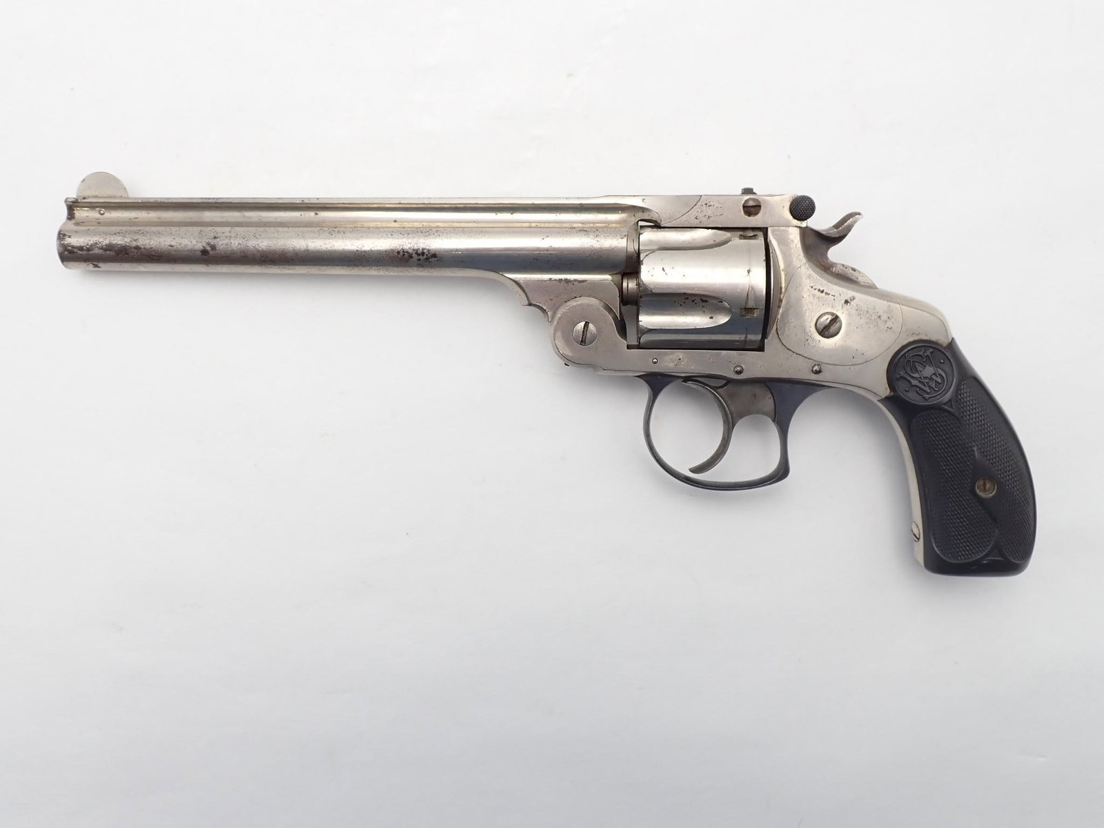 Smith & Wesson .38 DA 3rd Model Revolver: SN: 297300 Year of Mfg: 1884-1895 Cal: .38 S&W Action Type: Double Action Barrel Length: 6" Sights/Optics: Factory sights Stock: Black plastic factory grips Finish: Nickel, blued trigger guard