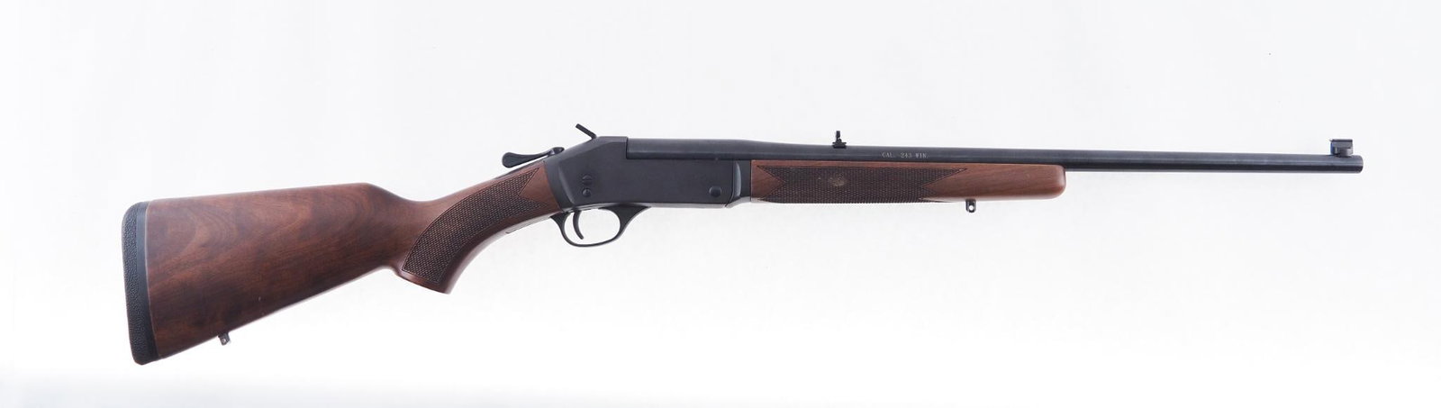 Henry H015-243 Rifle: SN: 243SSR00405 Cal: .243 Win Action Type: Single Shot Barrel Length: 22" Sights/Optics: Original open sights Stock: Original wood stock Finish: Blued Finish Cond: Original Bore: Excellent Overall