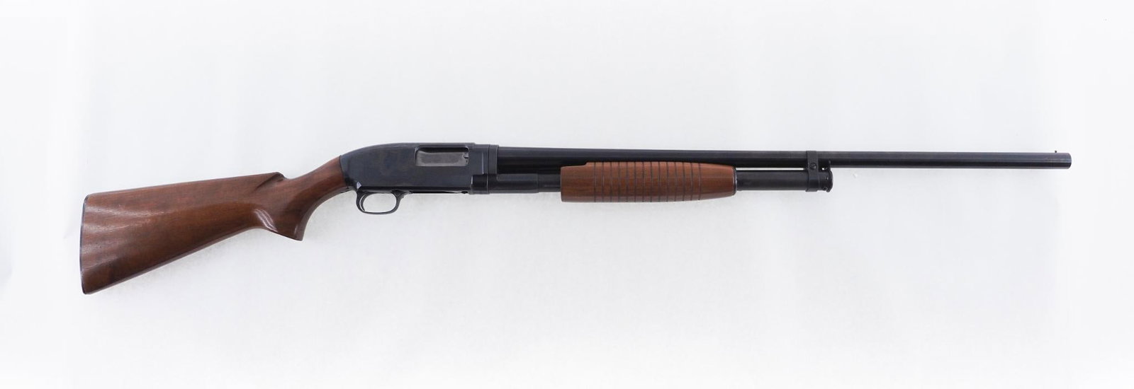 Winchester Model 12 Shotgun: SN: 1888948 Year of Mfg: 1960 Cal: 12 Ga. Action Type: Slide Action Markings: Barrel Marked "Winchester Model 12 12 Ga.. 2 3/4 CHAM. Winchester Proof Steel Barrel Length: 28" Sights/Optics: Front