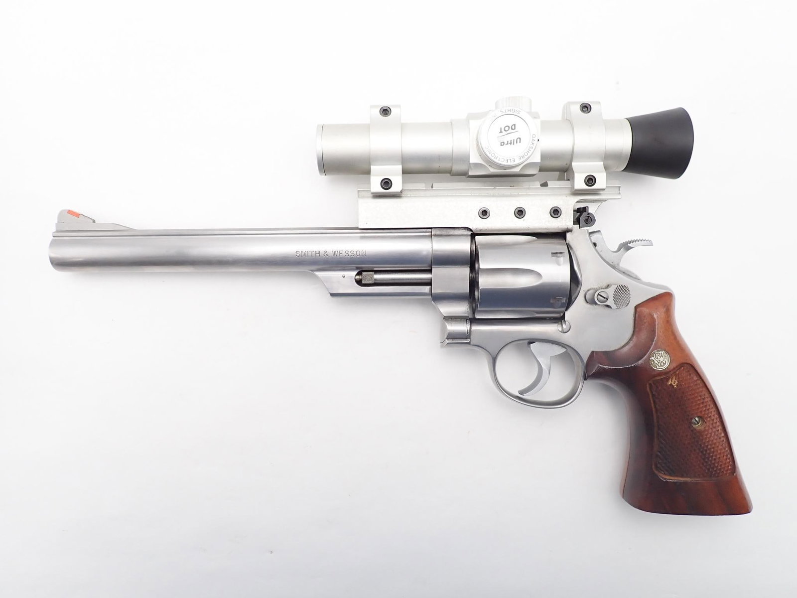 Smith & Wesson Model 629-1 Revolver: SN: AWA8126 Cal: .44 Mag Action Type: Double Action Barrel Length: 8.375" Sights/Optics: Original sights with an Oakshore Electronics Ultra Dot mounted on see through mount Stock: Original wood grips