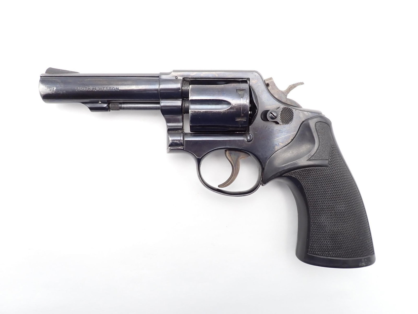 Smith & Wesson Model 10-6 Revolver: SN: D709706 Year of Mfg: 1962-1977 Cal: .38 SPL Action Type: Double Action Barrel Length: 4" Sights/Optics: Original sights Stock: Pachmayr presentation rubber grips Finish: Blued Finish Cond: Some