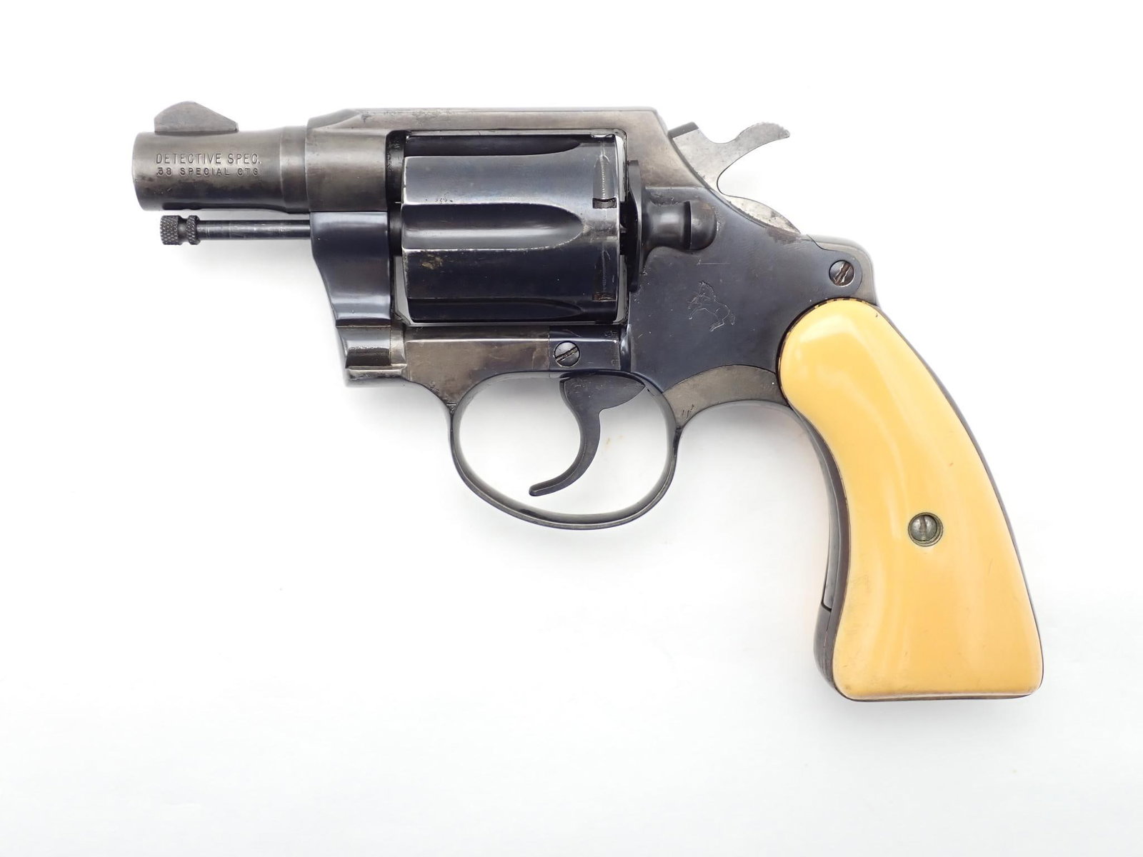 Colt Detective Special Revolver: SN: B33008 Year of Mfg: 1971 Cal: .38 SPL Action Type: Double Action Barrel Length: 2" Sights/Optics: Original sights Stock: Aftermarket Ivory look grips Finish: Blued Finish Cond: Worn in areas,