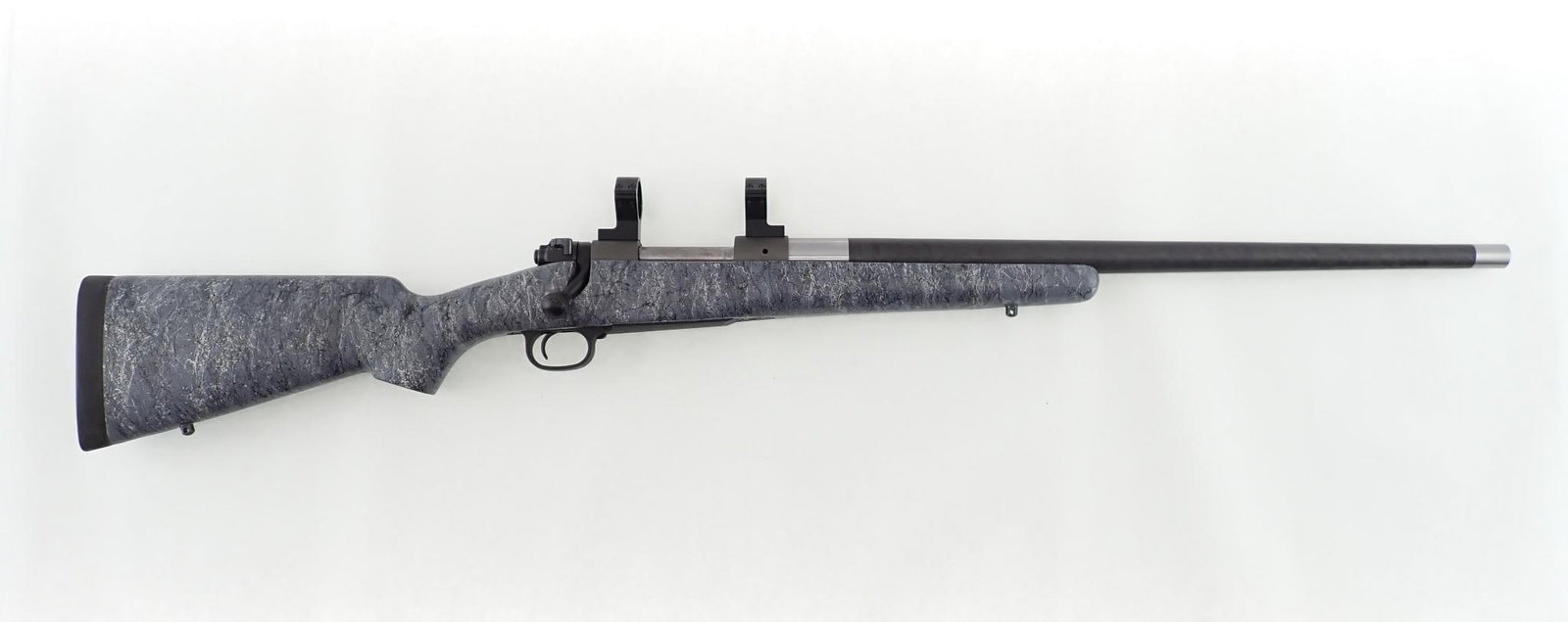 Custom Winchester 70 Rifle: SN: G2525777 Cal: .300 WSM Action Type: Bolt Action Barrel Length: 22" Carbon Fiber Barrel Sights/Optics: Tally 30mm Scope Rings mounted Stock: Gray Synthetic stock Finish: Jeweled bolt, receiver has