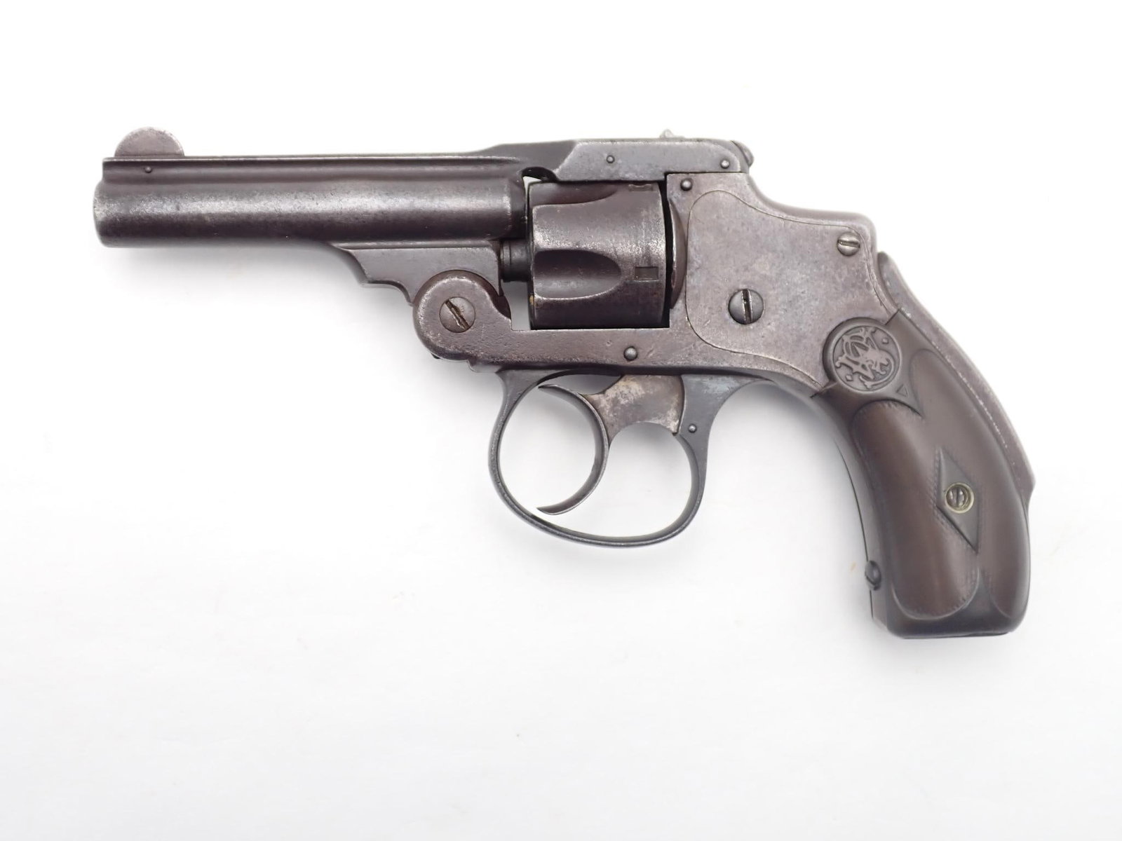 Smith & Wesson Safety Hammerless 1st Model Revolver: SN: 65235 Year of Mfg: 1888-1902 Cal: .32 S&W Action Type: Double Action Barrel Length: 3" Sights/Optics: Factory sights Stock: Original grips Finish: Blued Finish Cond: Worn Bore: Poor Overall