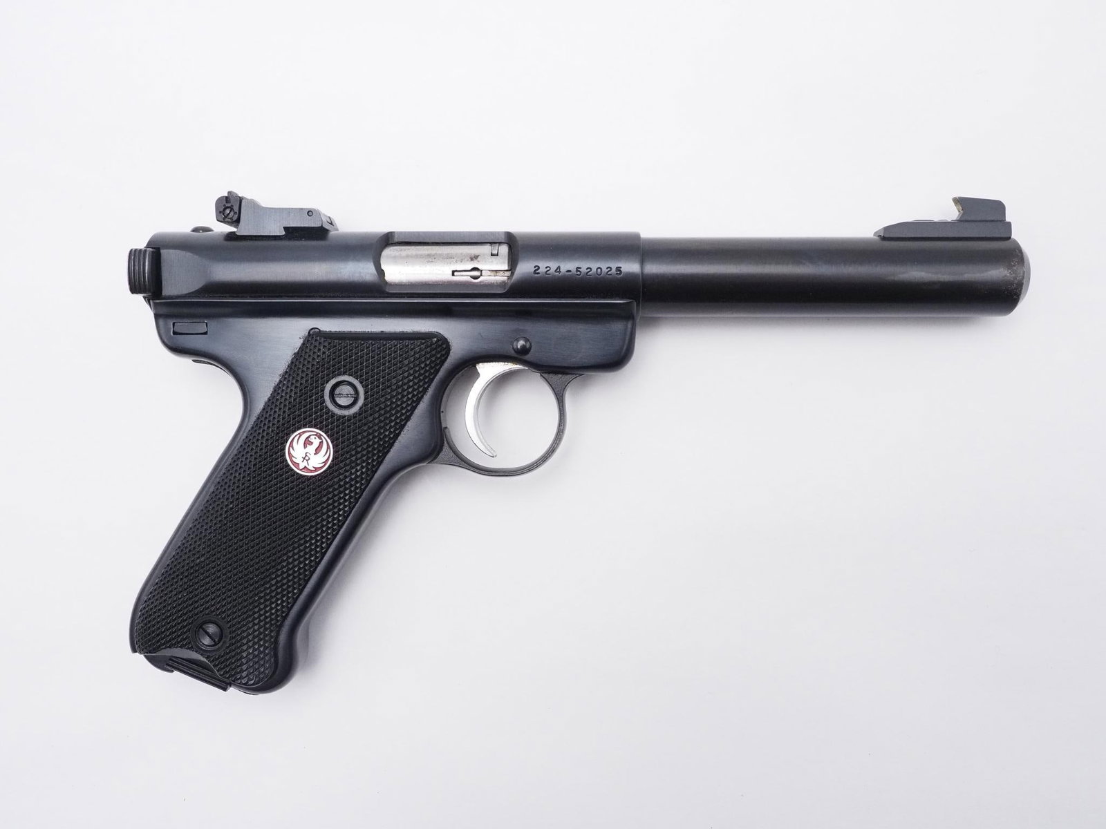 Ruger Mark II Target Pistol: SN: 224-52025 Cal: .22 LR Action Type: Semi Auto Barrel Length: 5.5" Sights/Optics: Factory adjustable sights Stock: Black plastic factory grips Finish: Blued Finish Cond: Original Bore: Very Good