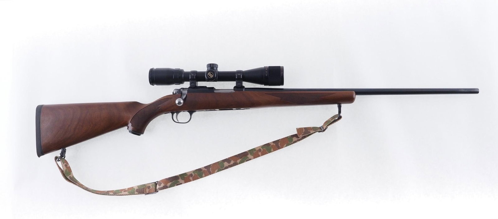Ruger 77/17 Rifle: SN: 703-68342 Cal: .17 HMR Action Type: Bolt Action Barrel Length: 22" Sights/Optics: Bushnell Banner 3.5-10x scope Stock: Original wood stock, excellent condition Finish: Blued Finish Cond: