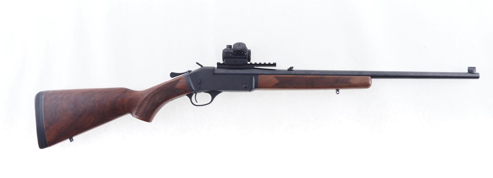 Henry H015-223 Rifle: SN: 223SSR03703 Cal: .223 Rem Action Type: Single Shot Barrel Length: 22" Sights/Optics: factory open sights and picatinny rail with bushnell red dot Stock: Original wood stock, a few handling marks
