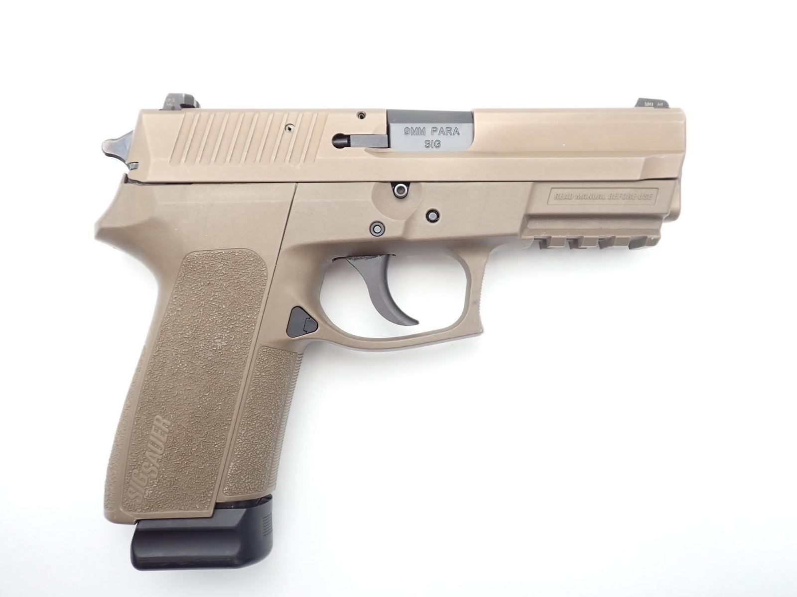 Sig Sauer SP2022 Pistol: SN: 24B242334 Cal: 9mm Action Type: Semi Auto Barrel Length: 3.75" Sights/Optics: Factory open sights Stock: FDE polymer frame Finish: FDE Coating Finish Cond: Original Bore: Very Good Overall Cond: