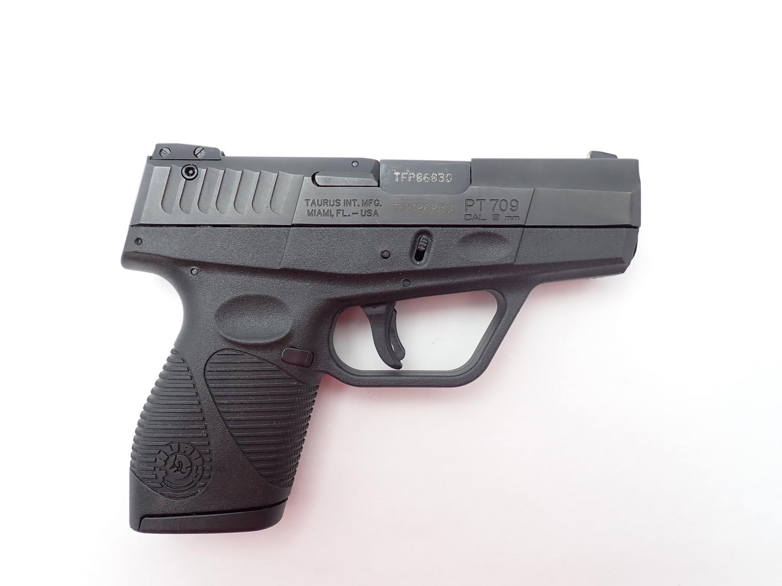 Taurus PT 709 Slim Pistol: SN: TFP86830 Cal: 9mm Action Type: Semi Auto Barrel Length: 3.3" Sights/Optics: Factory open sights Stock: Black alloy frame Finish: Blued steel slide and barrel Finish Cond: Original Bore: Very good