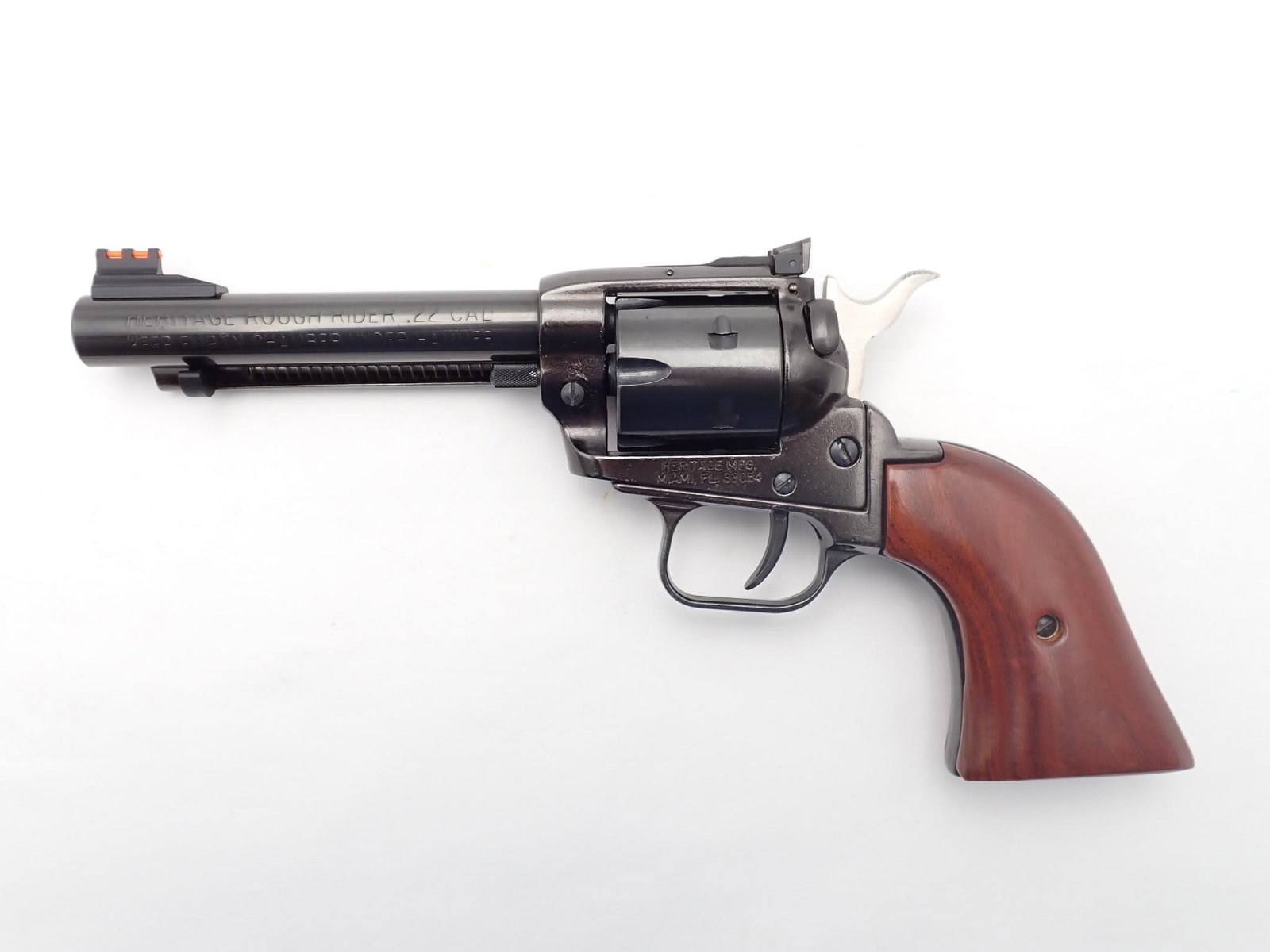 Heritage Rough Rider Revolver: SN: E37592 Cal: .22 LR / .22 Mag Action Type: Single Action Barrel Length: 4.75" Sights/Optics: Factory Fiber optic sights Stock: Original wood grips Finish: Blued Finish Cond: Original Bore: Good