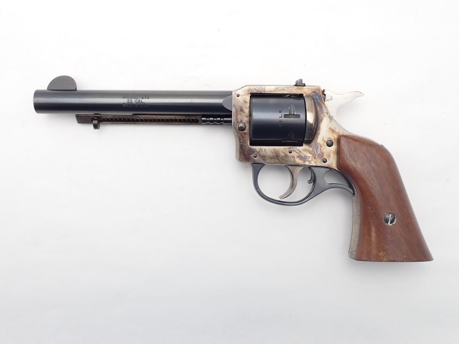 Harrington and Richardson Model 676 Revolver: SN: AR76189 Cal: .22 LR / .22 Mag Action Type: Double Action Barrel Length: 5.5" Sights/Optics: Factory sights Stock: Original wood grips, some handling marks Finish: Case hardened frame and