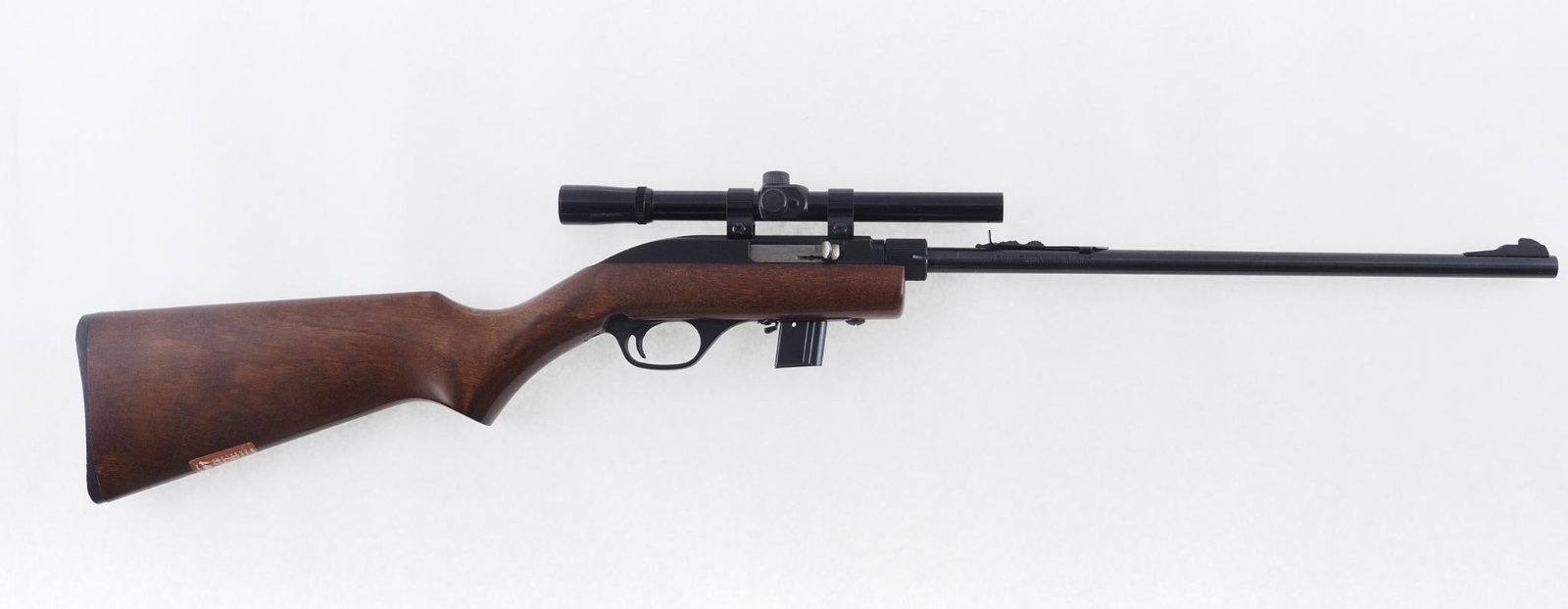Marlin 70P Papoose Rifle: SN: 14440409 Cal: .22 LR Action Type: Semi Auto Barrel Length: 16.5" Sights/Optics: Factory sights and a Tasco 4x15 scope Stock: Original wood stock, some handling marks Finish: Blued