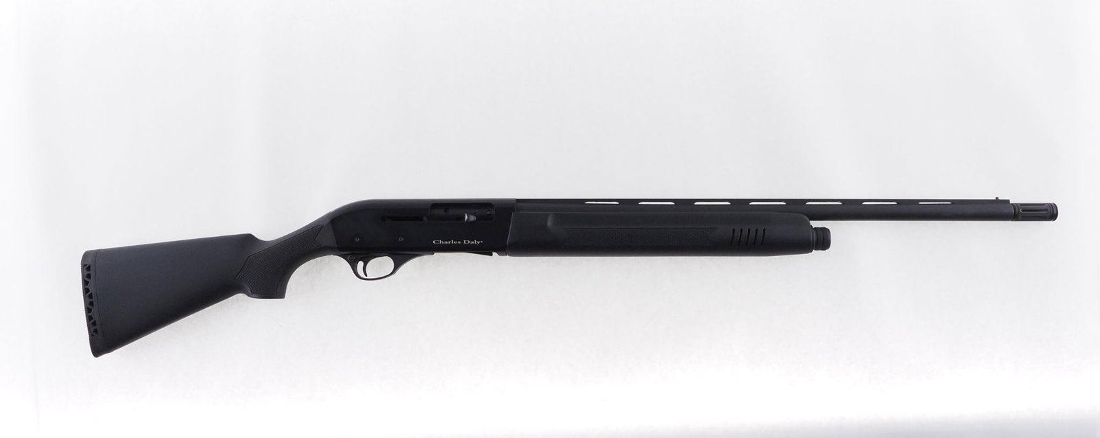Charles Daly Field Compact Shotgun: SN: 3211571 Cal: 20 Ga. Action Type: Semi-Auto Barrel Length: 22" vented rib barrel with extra full screw in choke tube Sights/Optics: Bead Stock: Black composite Finish: Black matte finish
