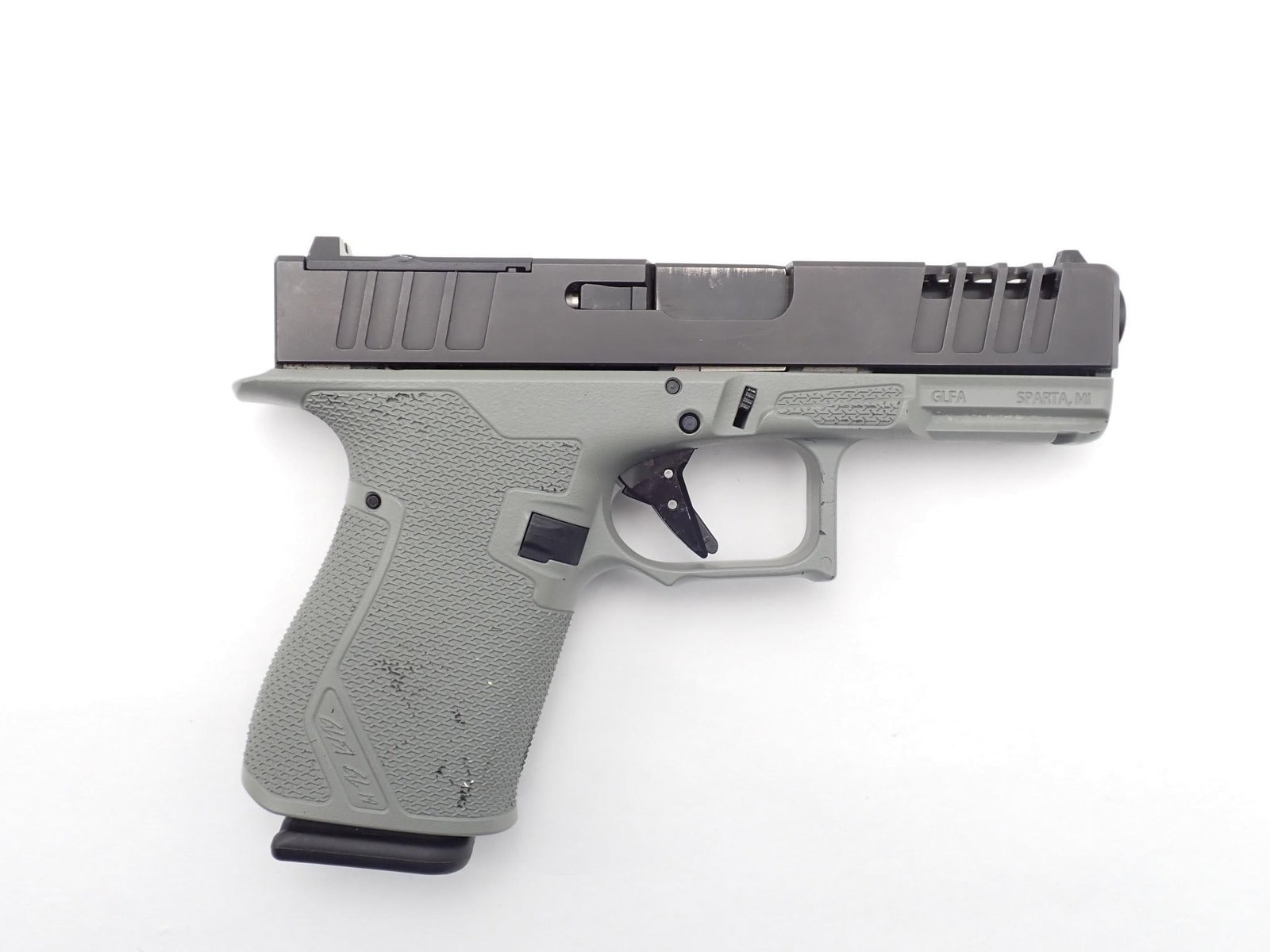 Great Lakes Firearms GL19 Striker Pistol: SN: 19000437 Cal: 9mm Action Type: Semi Auto Barrel Length: 4" Sights/Optics: Factory sights Stock: Grey Polymer Frame Finish: Black Coated Finish Cond: Orignal Bore: Very Good Overall Cond: Very