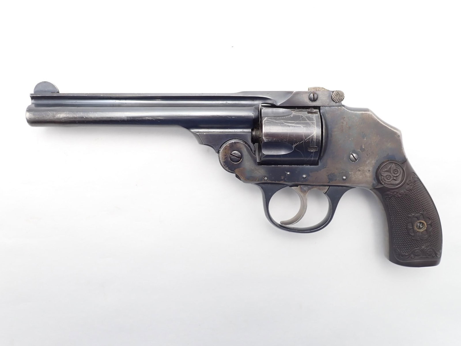 Iver Johnson 3rd Hammerless Revolver: SN: 85802 Year of Mfg: 1909-1941 Cal: .38 S&W Action Type: Double Action Barrel Length: 5" Sights/Optics: Original sights Stock: Original grips, left side has a chip on butt Finish: Blued Finish