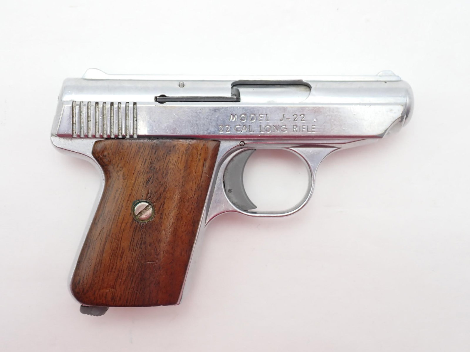 Jennings J-22 Pistol: SN: 108124 Cal: .22 LR Action Type: Semi Auto Barrel Length: 2.5" Sights/Optics: Factory sights Stock: Wood grips Finish: Nickel Finish Cond: Original Bore: Very Good Overall Cond: Good Mechanical:
