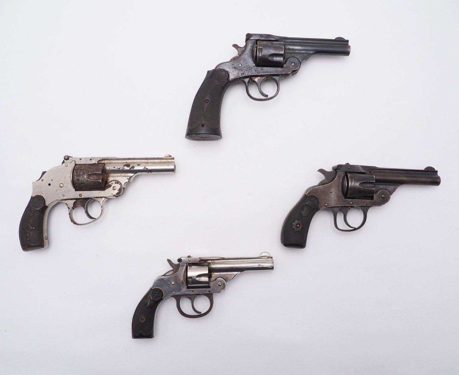 (4) Double Action Top Break Revolvers: Cal: .32 CF Action Type: Double Action Markings: Thames Arms, s.n. 9523; Forehand Arms, s.n. 382208; Harrington & Richardson, s.n. 379144; American Arms, s.n. 3072 Stock: Plastic grips Finish: