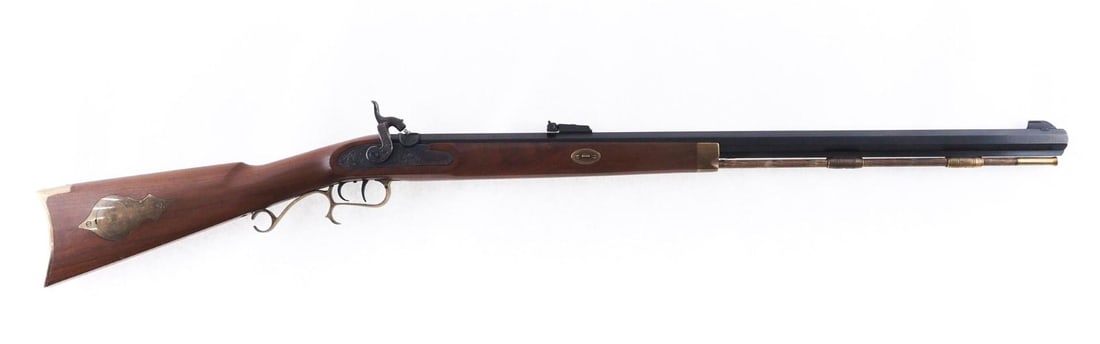 Thompson Center Hawken Rifle: SN: 379241 Cal: .50 Cal Action Type: Percussion Barrel Length: 28" Sights/Optics: Original open sights Stock: Factory wood stock with brass hardware Finish: Blued barrel, case color lock plate and