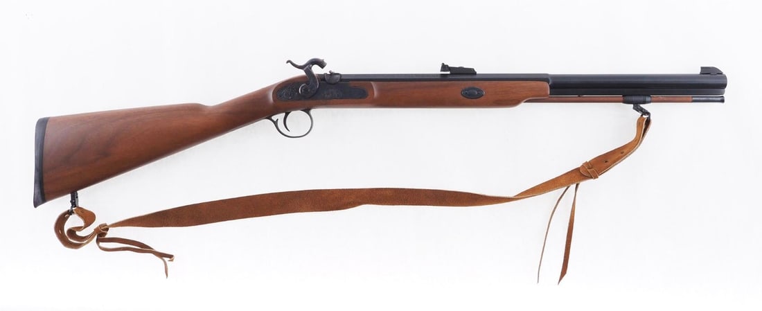 Thompson Center White Mountain Carbine: SN: 18978 Cal: .50 Cal Action Type: Percussion Barrel Length: 21" Sights/Optics: original open sights Stock: Original wood stock Finish: Blued barrel, case color lock plate and hamme