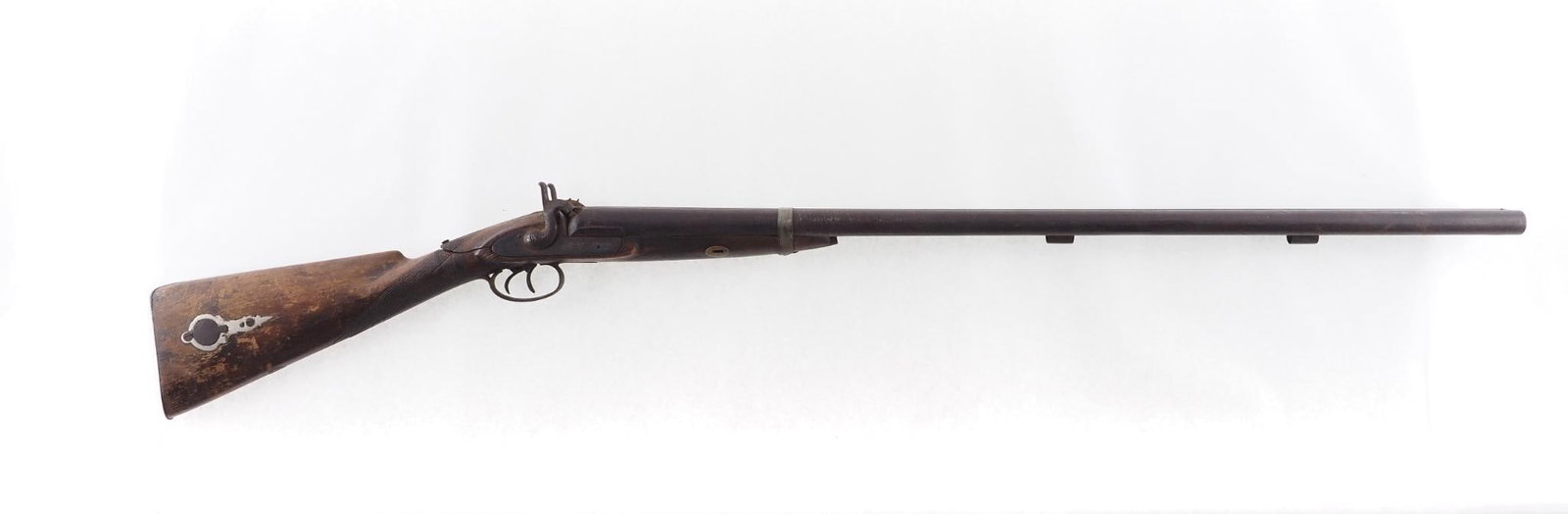English Percussion Shotgun: Cal: 10GA Action Type: Percussion Barrel Length: 33.5" Sights/Optics: Front bead Stock: Stock heavily cracked Finish: Damascus barrels Finish Cond: Original Overall Cond: Poor Mechanical: Poor