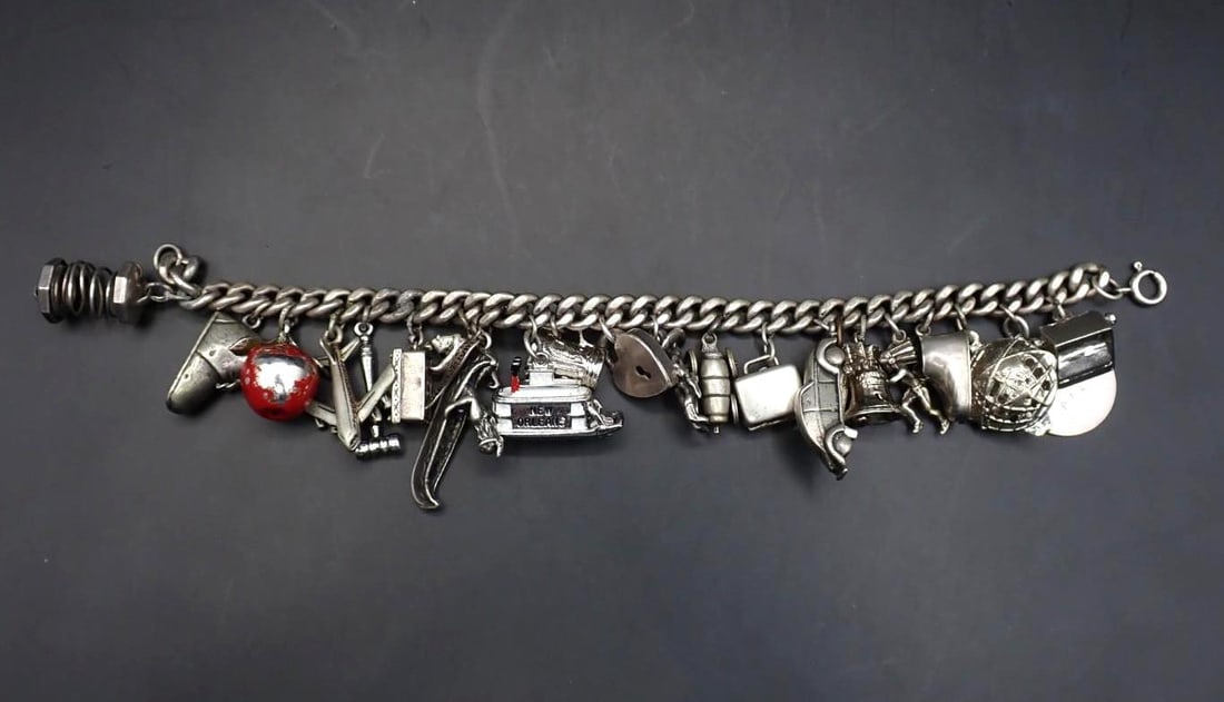 Sterling Silver Charm Bracelet with (23) Charms: a few of the charms might not be silver, 88 grams total weight