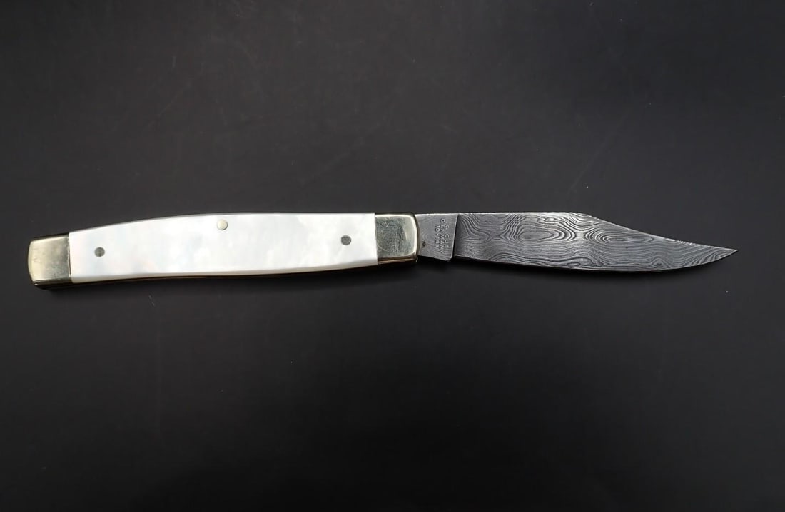 G. Cut 10-161 Black Forest Damascus Folding Knife: 7" overall length, pearl handles, made in Germany, excellent condition