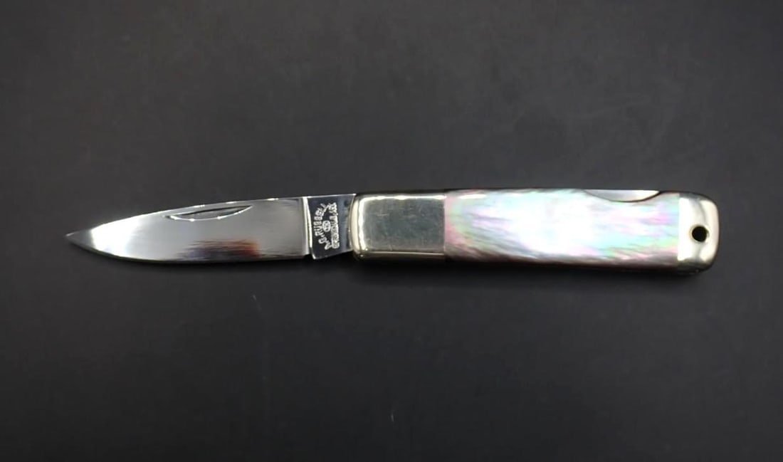 A.G. Russell Folding Knife: 4.875" overall length, pearl handles, excellent condition