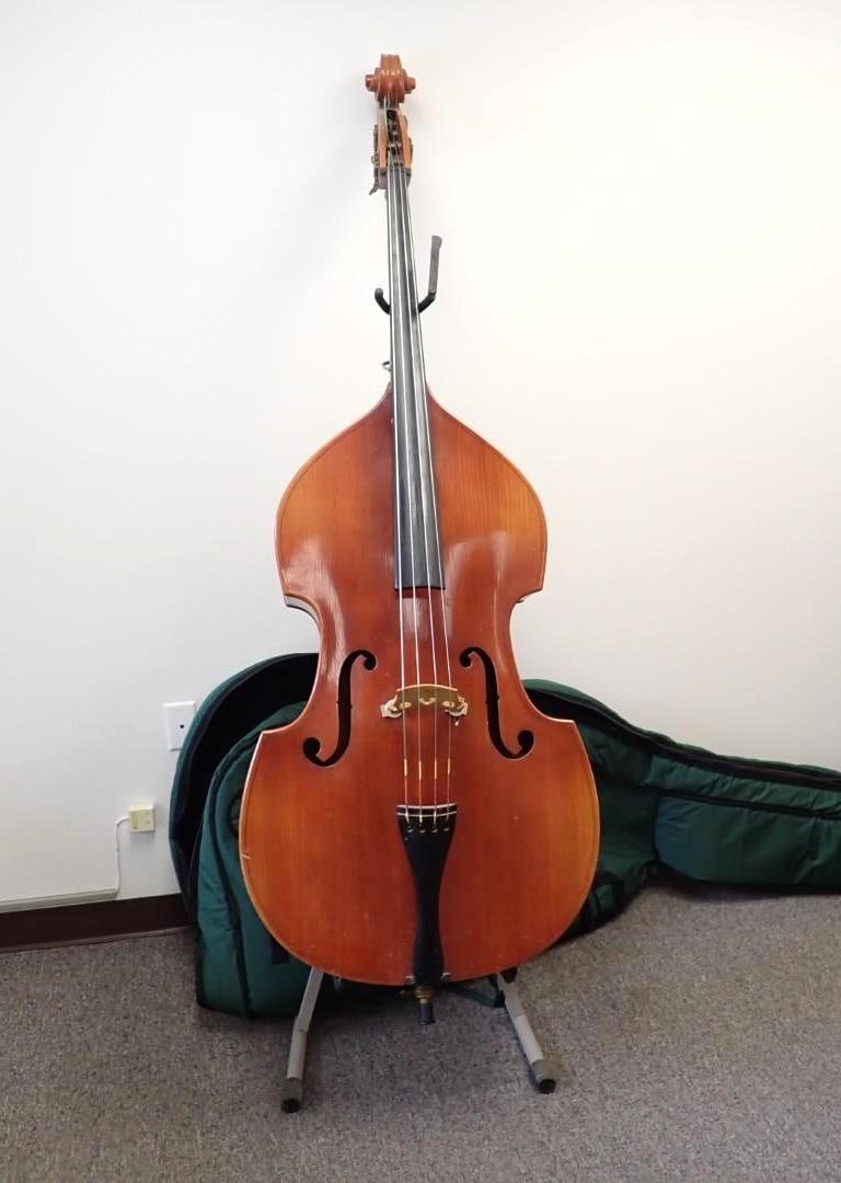 German 3/4 Size Upright Bass: approx. 72" bottom of body to scroll, tagged "Made in German Democratic Republic", some wear, with a folding metal stand and Gollihur green padded gig bag