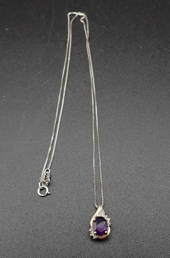 10K Yellow Gold, Sterling Silver, Amethyst & White Sapphire Pendant: 8mm x 6mm oval cut amethyst, the pendant 15mm in height, on 20" sterling silver box link chain, 3.04 grams total weight