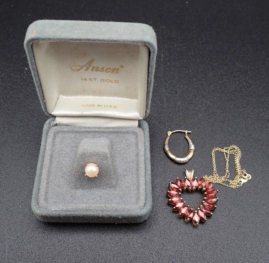 10K Yellow Gold & Garnet Pendant and 14K Yellow Gold Earring: the pendant being 24mm in width, set with (17) 6mm x 3mm marquis cut garnets, on 16" 10K yellow gold chain, 3.69 grams total weight; the earring weighing .388 grams; also included is a pearl tie tack