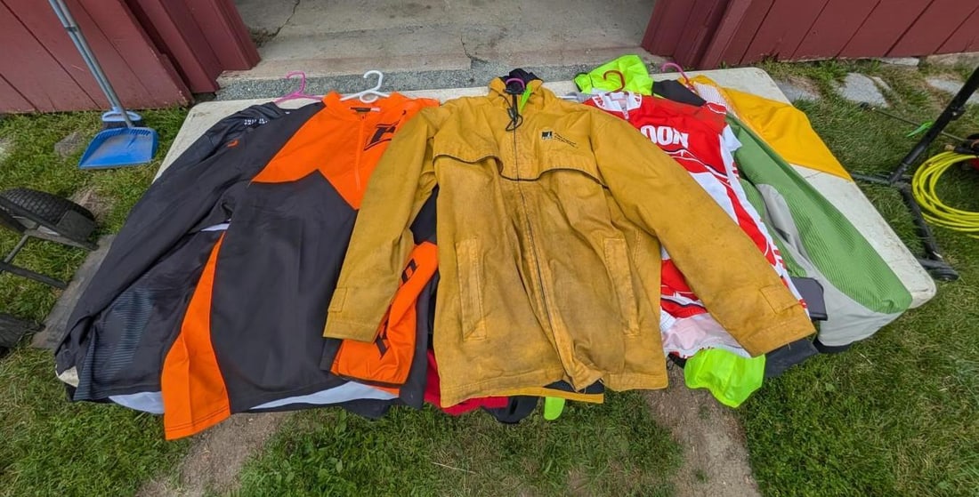 (11+/-) Rain Jackets, Jerseys, Sweatshirts, Etc.: Most are size: large, (1) 2XL, (1) Small, (1) medium, Location: Garage