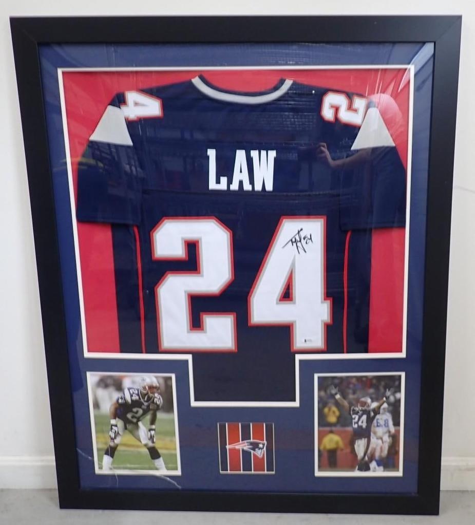 Ty Law Autographed New England Patriots Jersey: Ty Law Autographed New England Patriots Jersey -Beckett witnessed and certified, 43.5" x 35.5" framed, plexiglass cracked