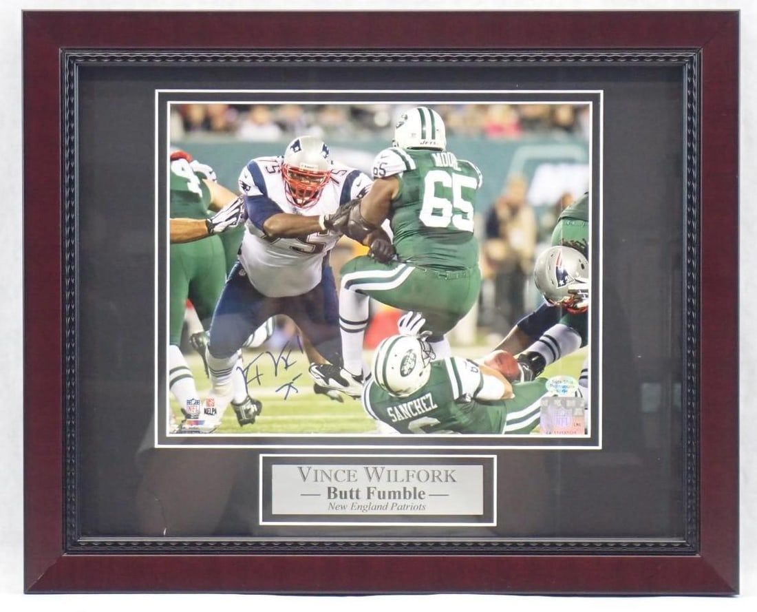 Vince Wilfork Autographed Color Photograph "Butt Fumble": Vince Wilfork Autographed Color Photograph "Butt Fumble" -Sure Shot Promotions hologram 57494 & NFL hologram LA 119187023 affixed,13" x 16" framed