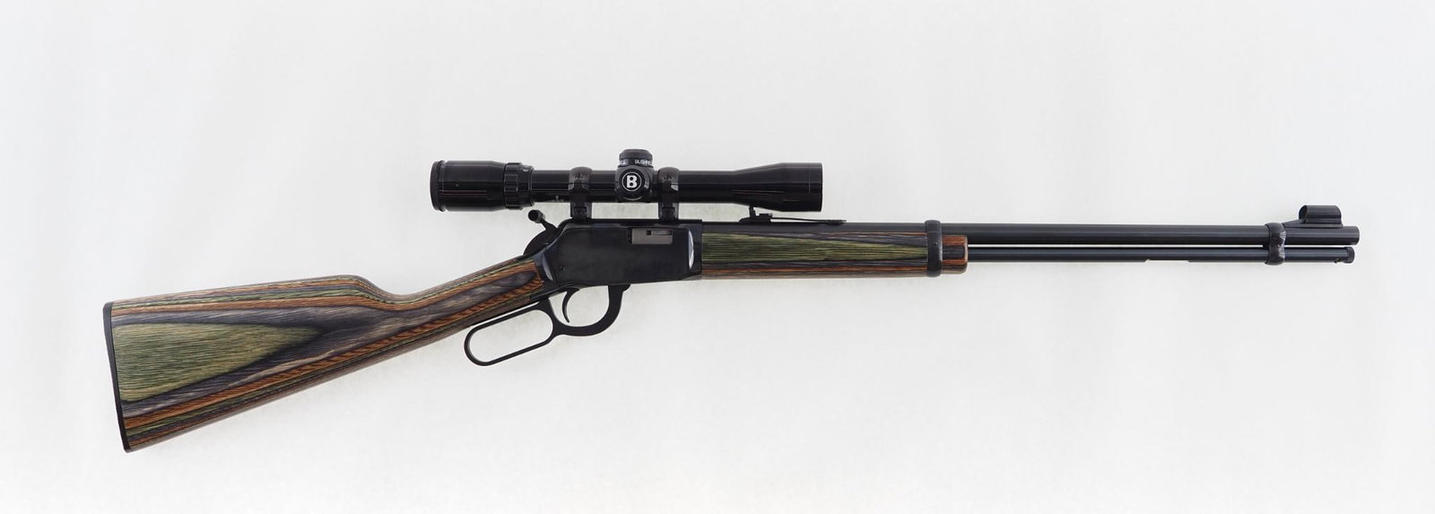 Winchester 9422M Rifle: SN: F703267 Cal: .22 Magnum Action Type: Lever Action Barrel Length: 20" Sights/Optics: adjustable rear sight & Bushnell Sportview 3-9X32 scope Stock: laminated hardwood Finish: blue Finish Cond: