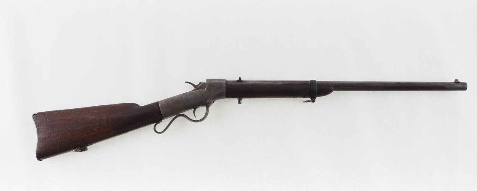 Ball & Williams Ballard Carbine: SN: 6497 Cal: .44 RF Action Type: Falling Block Barrel Length: 22" octagon Sights/Optics: fixed sights Stock: walnut, light handling marks, probably refinished Finish: lightly pitted bare metal