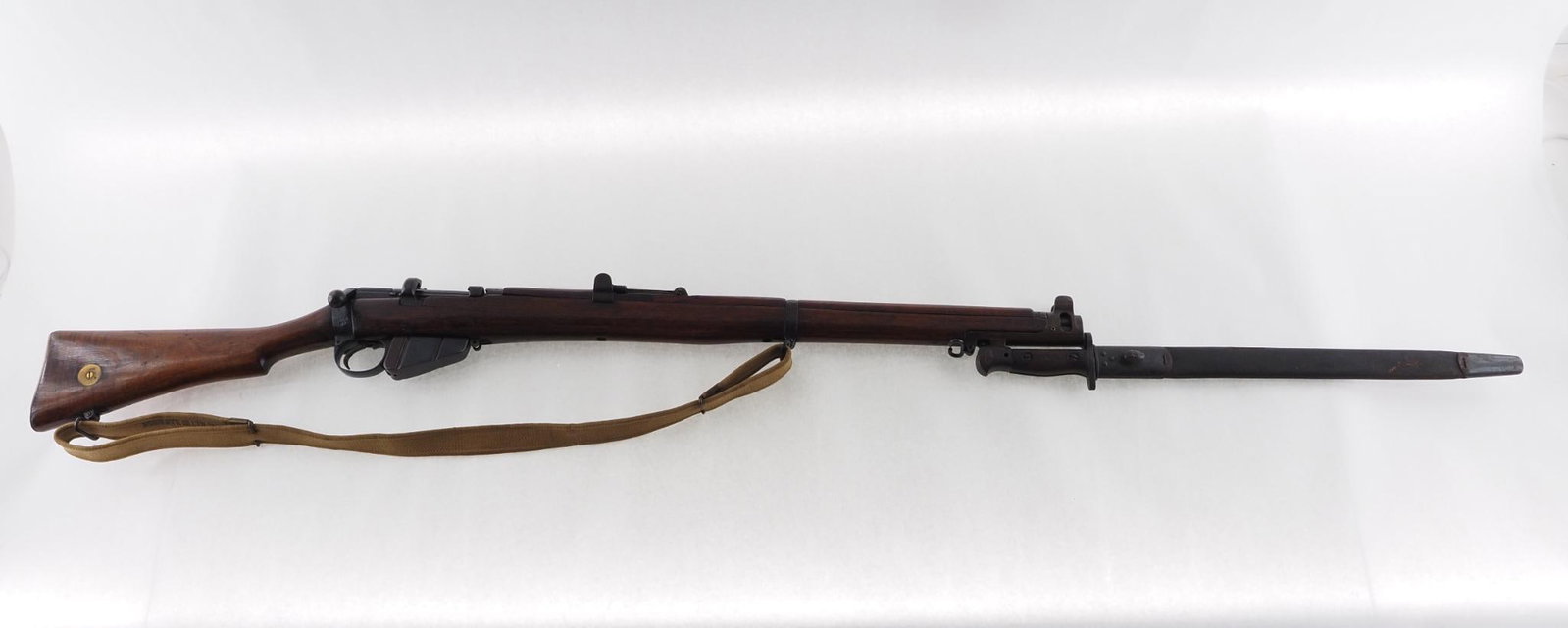 British Enfield SMLE Rifle: SN: B515 Cal: .303 British Action Type: Bolt Action Stock: handling and storage marks, old repair at stock toe Finish: even wear Bore: fair with prevalent pitting Overall Cond: good Mechanical: very