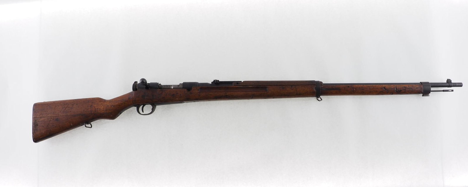 Japanese Arisaka Type 38 Rifle: SN: 747377 Cal: 6.5x50mm Action Type: Bolt Action Barrel Length: 31.5" Sights/Optics: original military sights Stock: Wood Finish: mum ground off Bore: fair Overal