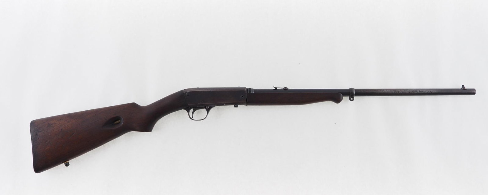 Remington 24 Rifle: SN: 80433 Cal: .22 LR Action Type: Semi-Automatic Barrel Length: 19.5" Sights/Optics: adjustable rear sight Stock: smooth walnut with dings, nicks and scratches Finish: blue turning brown with some