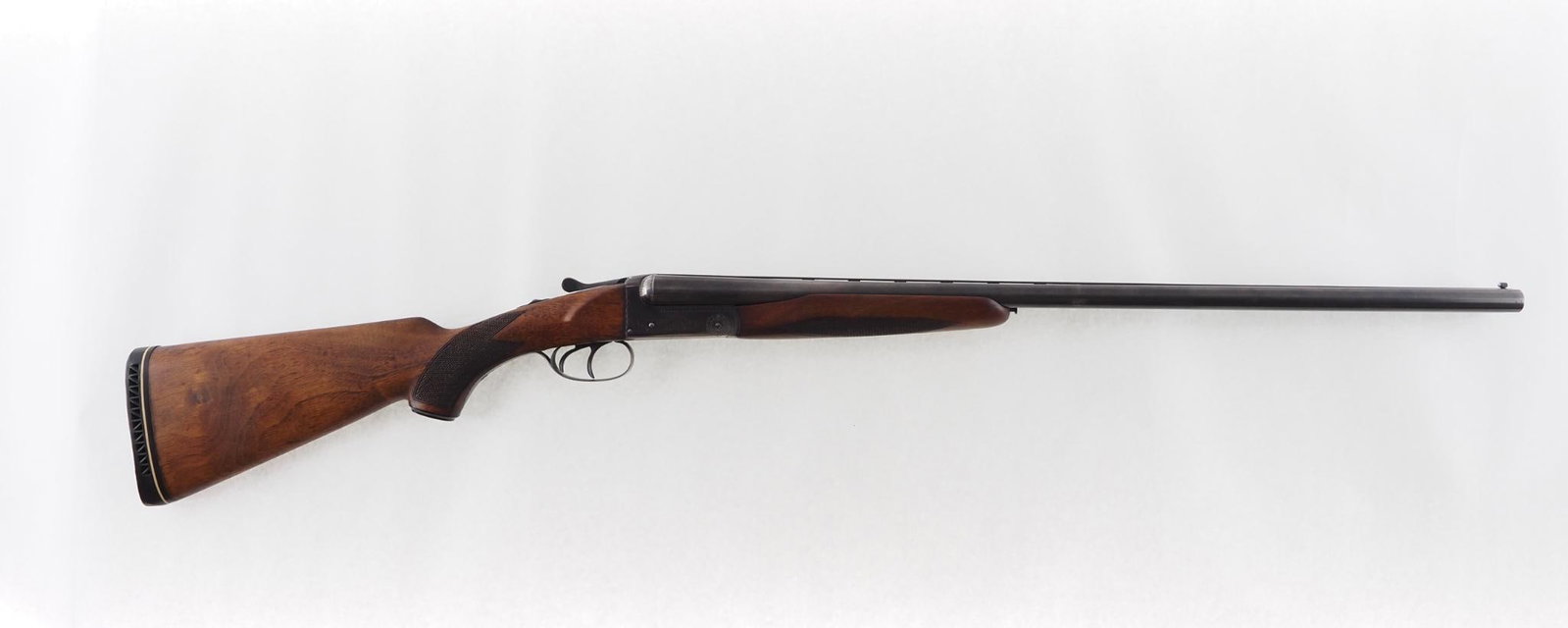 Charles Daly 500 Shotgun: SN: 223511 Cal: 20 Ga. Action Type: Side by Side Barrel Length: 26" ventilated rib Sights/Optics: bead front Stock: checkered walnut Finish: blue, even wear, lightly engraved receiver Bore: very good