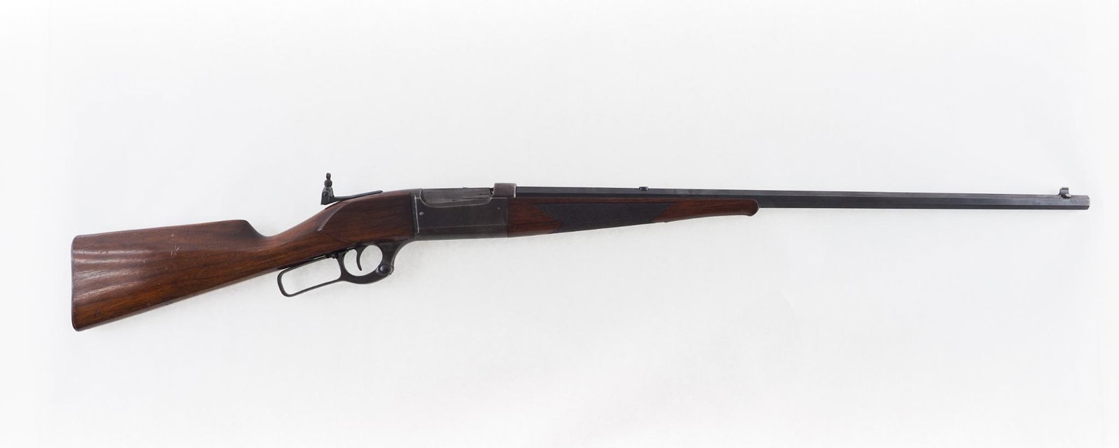 Savage 1899 Rifle: SN: 16161 Year of Mfg: 1900 Cal: .30 Savage Action Type: Lever Barrel Length: 26" octagon Sights/Optics: tang sight Stock: checkered walnut forend with minor handling marks and cracks