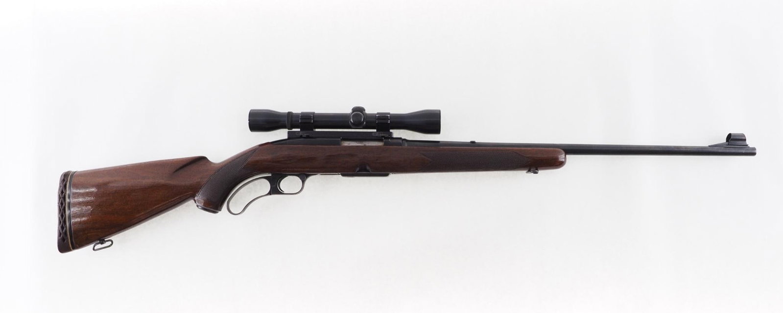 Winchester 88 Rifle: SN: 69158 Year of Mfg: 1958 Cal: .308 Win. Action Type: Lever Barrel Length: 22" Sights/Optics: vintage Weaver K4 scope Stock: checkered walnut with light handling marks Finish: strong blue Bore: