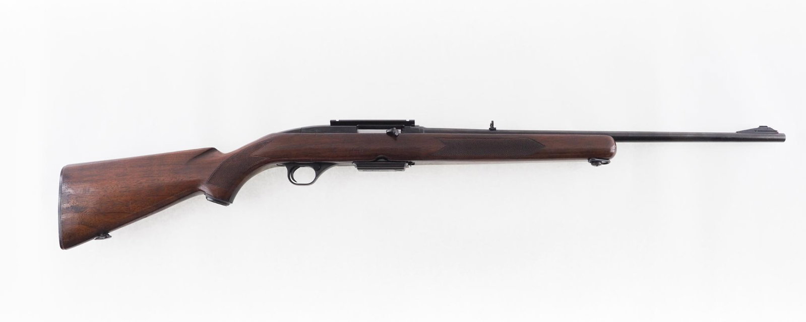 Winchester 100 Rifle: SN: 49149 Year of Mfg: 1962 Cal: .243 Win. Action Type: Semi-Automatic Barrel Length: 22" Sights/Optics: Lyman adjustable rear sight Stock: checkered walnut with handling marks