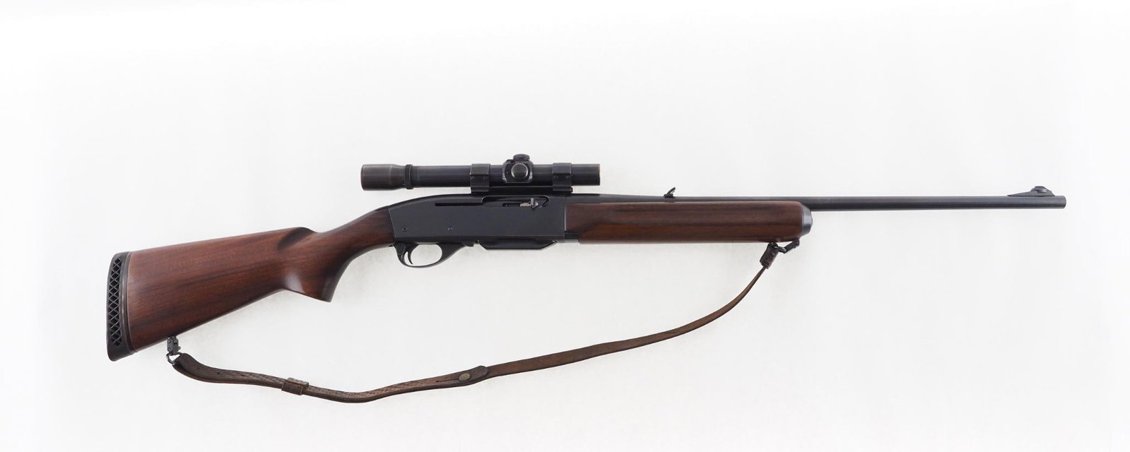 Remington 740 Woodsmaster Rifle: SN: 100668 Cal: .30-06 Action Type: Semi-Automatic Barrel Length: 22" Sights/Optics: vintage Weaver K25 scope Stock: smooth walnut Finish: strong blue with light wear at high points Bore: good with