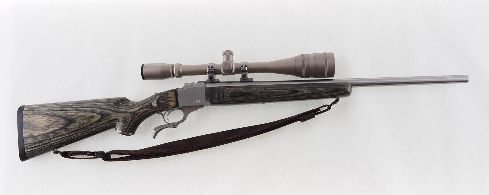 Ruger No. 1 Rifle: SN: 133-87418 Cal: .22-250 Action Type: Falling Block Barrel Length: 23.125" Sights/Optics: Burris 8-32X scope Stock: laminated hardwood Finish: stainless steel Bore: excellent Overall Cond: