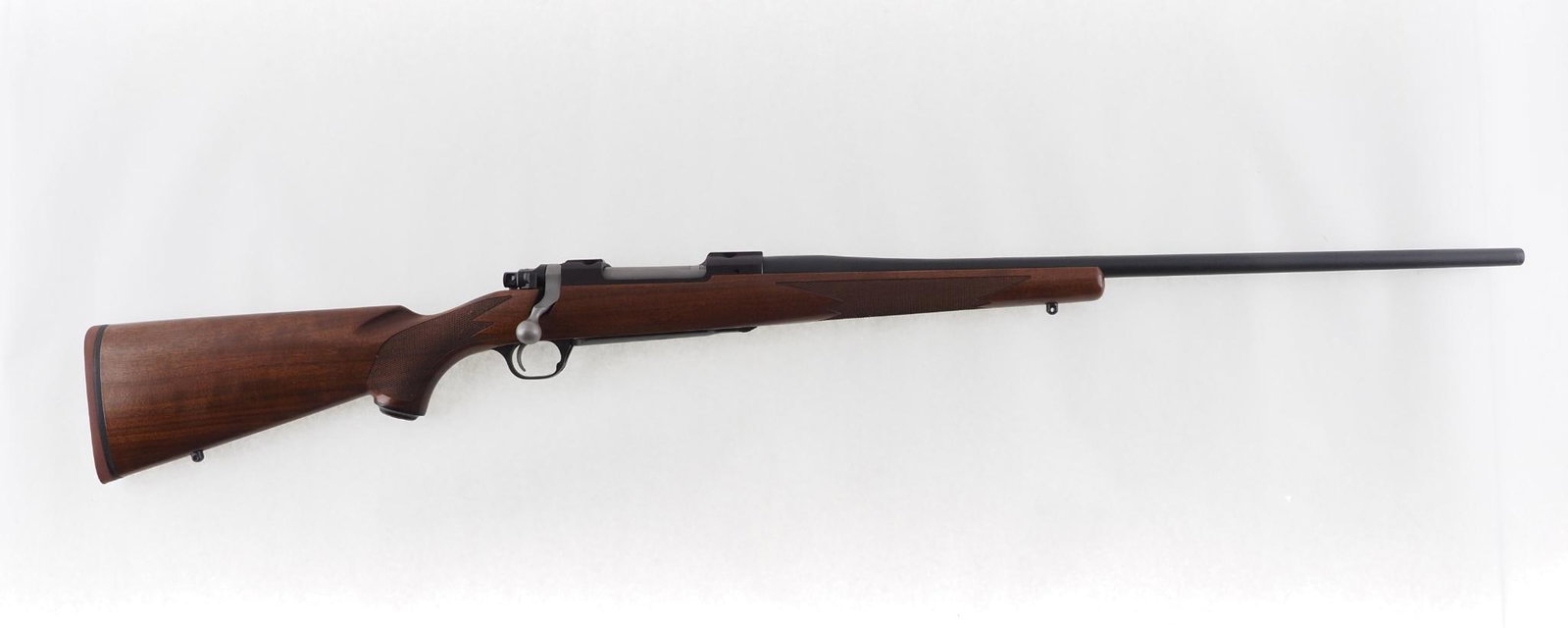 Ruger M77 Hawkeye Rifle: SN: 710-96064 Cal: 7mm Rem. Mag. Action Type: Bolt Action Barrel Length: 24" Sights/Optics: none Stock: checkered walnut Finish: blue Bore: excellent Overall Cond: excellent Mechanical: fine
