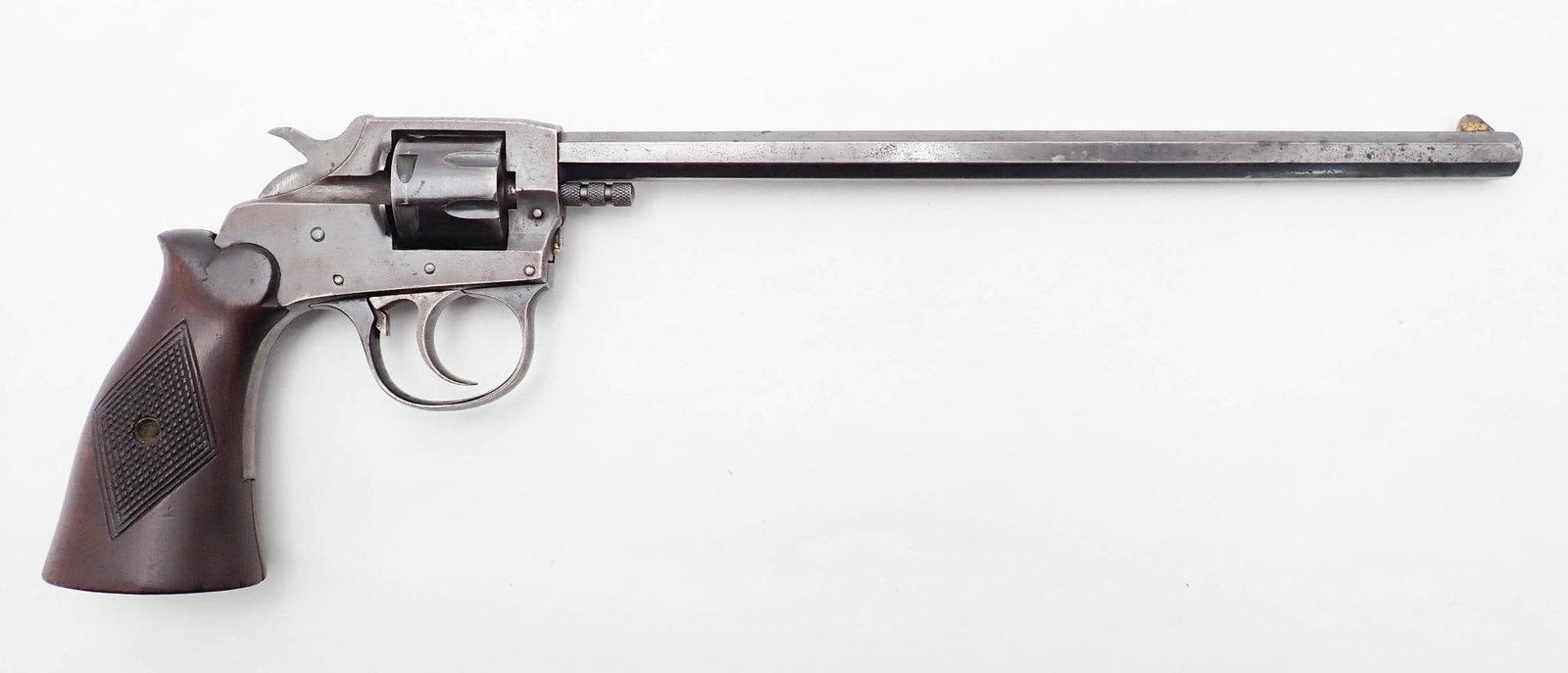 Iver Johnson Target 1900 Revolver: SN: 30131 Cal: .22 Action Type: Double Action Barrel Length: 9.375" Stock: checkered walnut Finish: thinning blue Bore: good / very good Overall Cond: fair Mechanical: