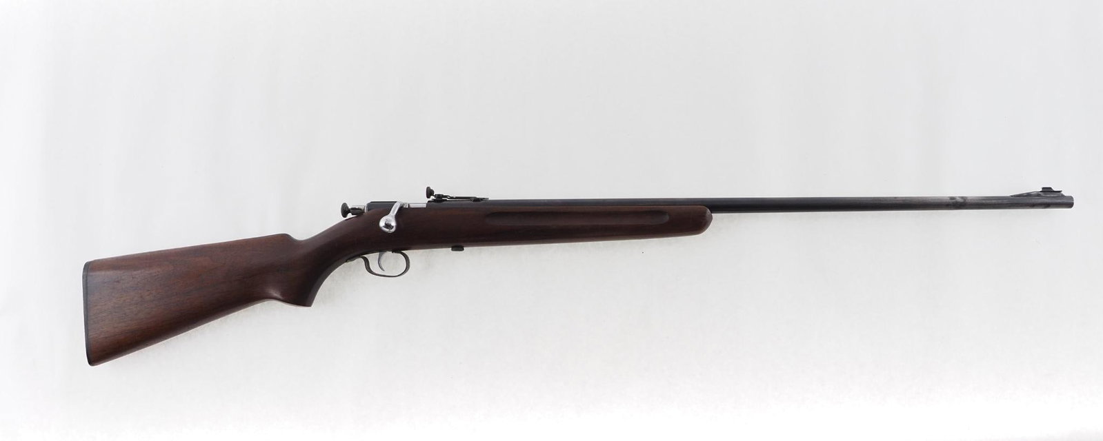 Winchester Model 68 Rifle: SN: 1543 Cal: .22 LR Action Type: Bolt Action Barrel Length: 27" Sights/Optics: adjustable sights Stock: walnut Finish: blue Bore: very good Overall Cond: very good with slight bluing wear on barrel