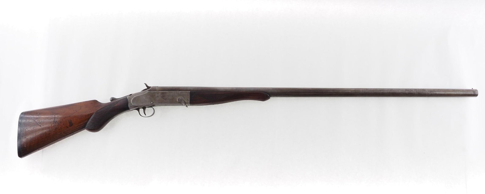 Empire State Arms Single Shot Shotgun: SN: 2068 Cal: 10 Ga. Action Type: Single Shot Barrel Length: 36", full choke Sights/Optics: beaded front sight Stock: checkered walnut , small sliver missing at trigger guard Finish: blue turned to